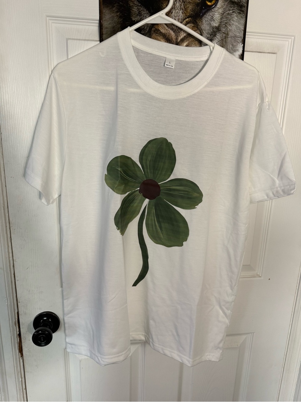 White Tee with Large Green Flower Graphic